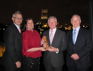 DaDaFest Chair, Gary Timperley, CEO of DaDaFest, Ruth Gould, NWBLT Chair, Paul Lee and Geoffrey Piper, CEO of the NWBLT with this year’s Lever Prize trophy, produced by John Adamson from the Lancashire and Cheshire Woodcarvers